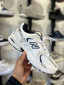 NB 530 BRANCO PRATA MARINHO na internet
